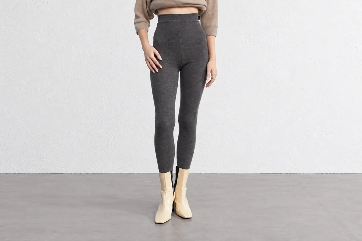 Charcoal tapered knit pants with a high waistband.