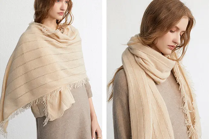 Beige striped scarf with fringe, shown draped over the shoulders and around the neck.