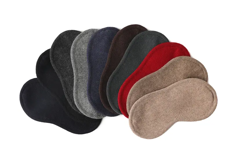 Knit eye masks in black, gray, navy, brown, green, red, and beige.